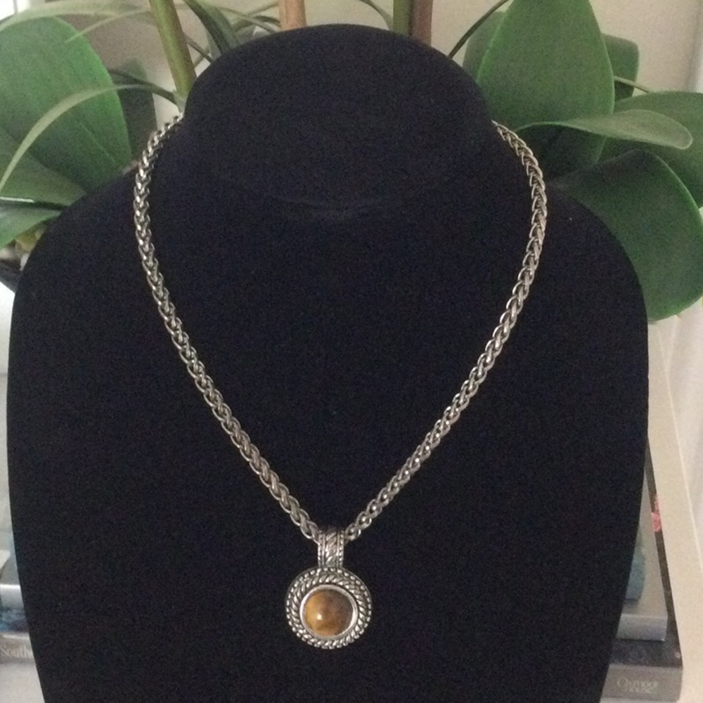 Necklace, not sure what brand.Silver in and